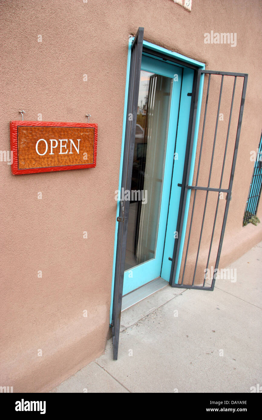 A Store With An Open Sign On The Front And Doors Open Albuquerque
