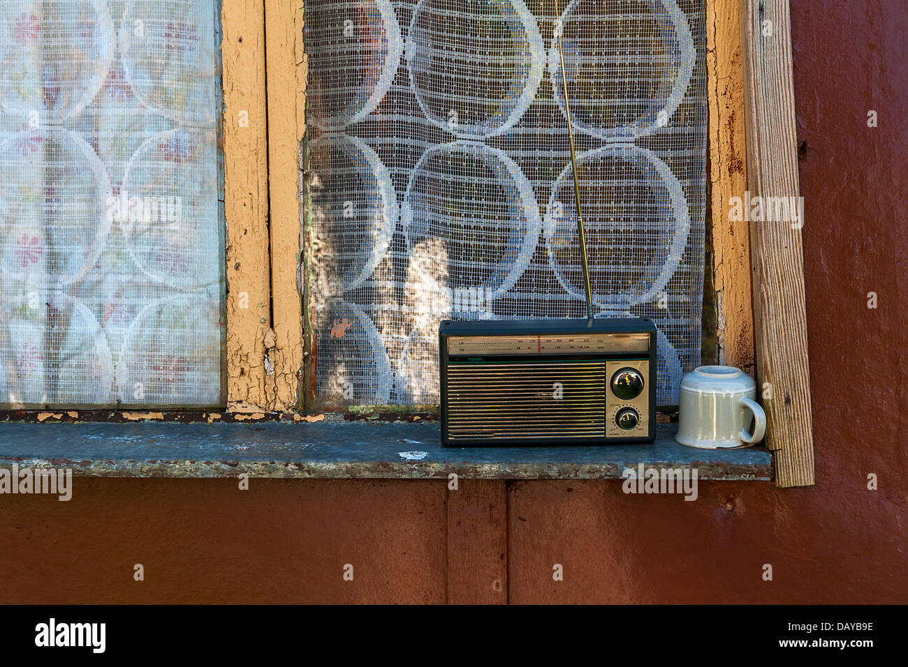 Old radio and a cup on the window sill Stock Photo Alamy