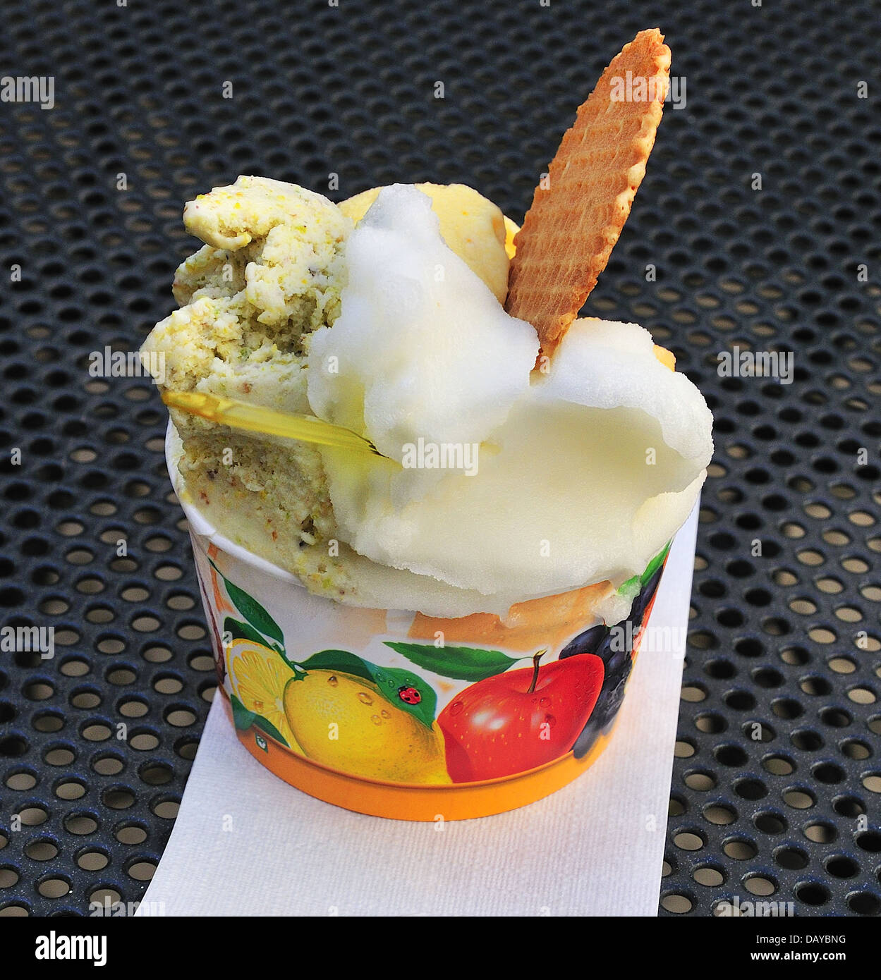 Gelato and sorbet with wafer in tub on a table bought from an Ice cream parlor Otranto, Southern Italy Stock Photo