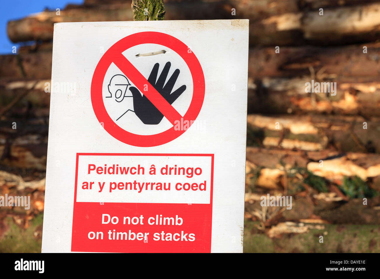 Danger do not climb on timber stacks sign Stock Photo