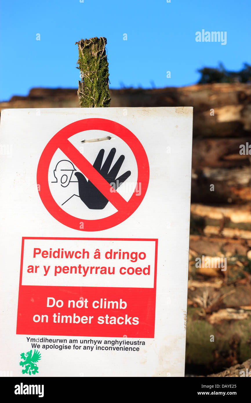 Danger do not climb on timber stacks sign Stock Photo