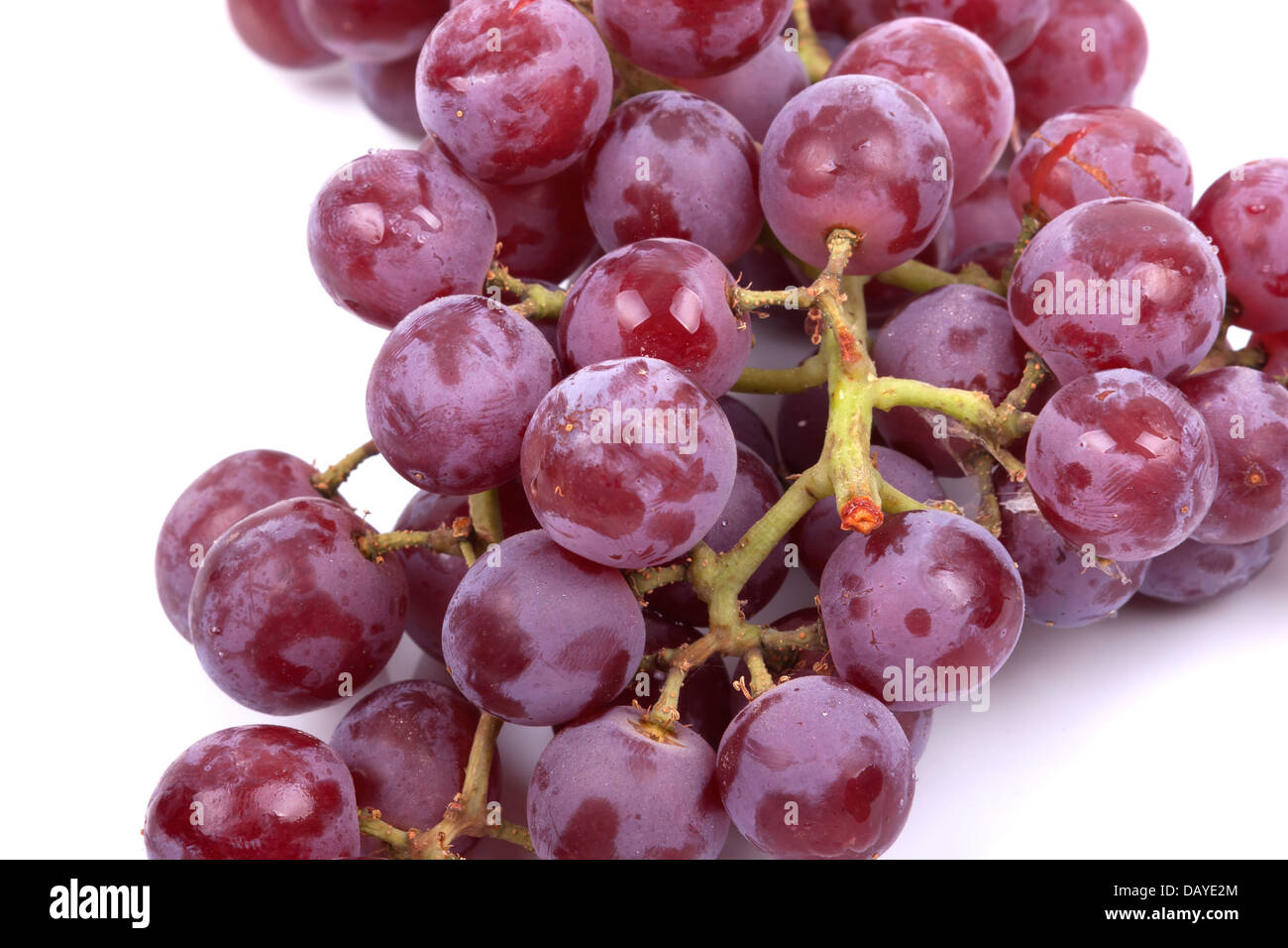Cluster of red grapes isolated on a white background Stock Photo