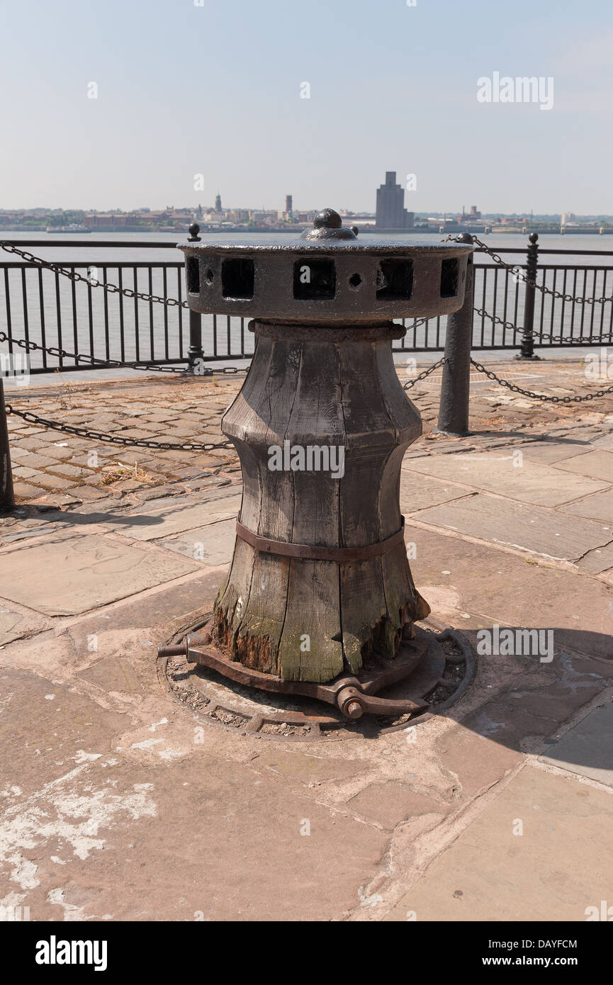 Merseyside old ship capstan ratchet mechanism at base for mooring up ship no longer visiting the quayside relic of the past Stock Photo