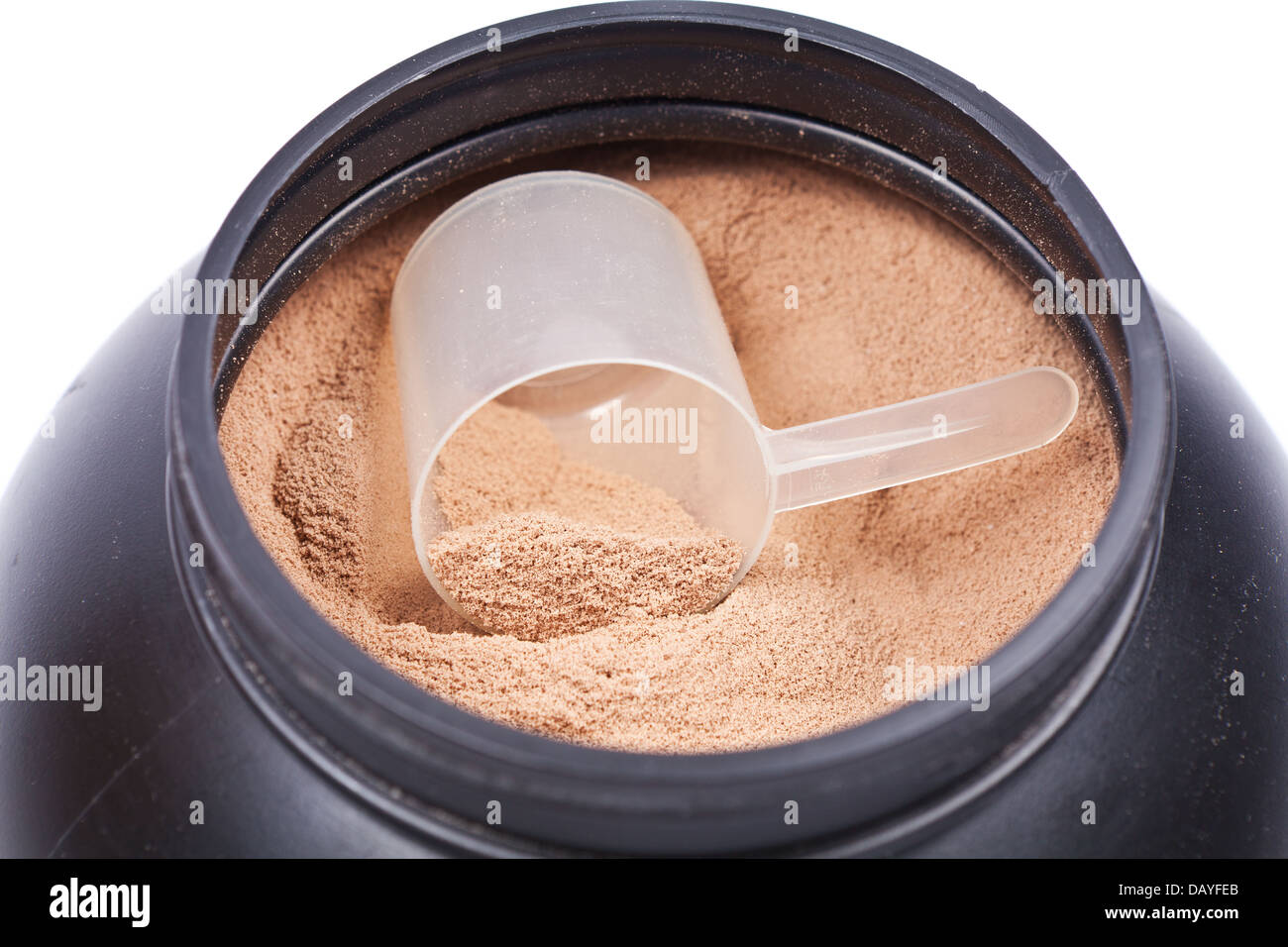 Scoop of chocolate whey isolate protein in a black plastic container on