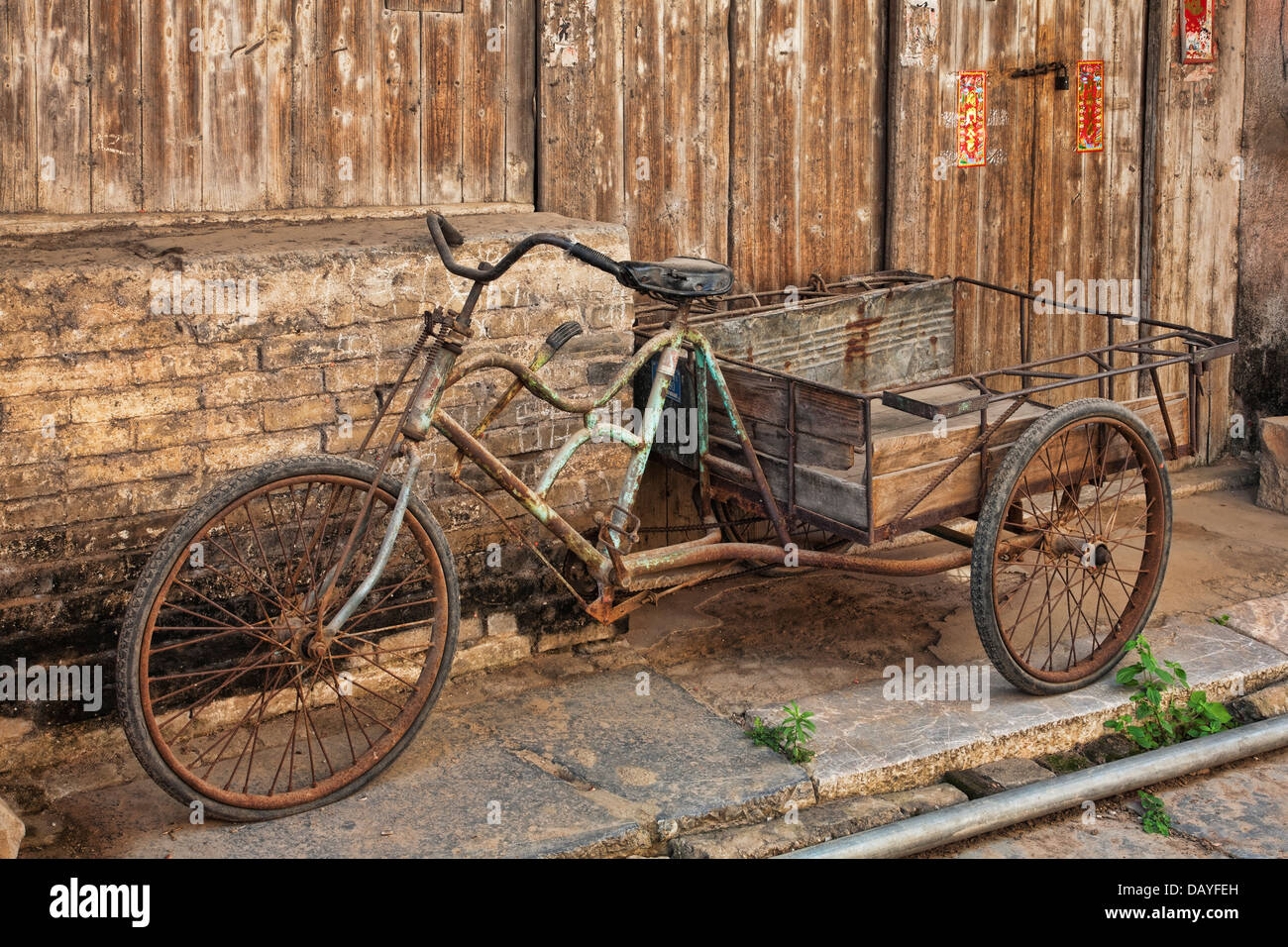 An antique bicyle in the old town of Daxu. Daxu Ancient Town was formed at the beginning of the Song dynasty. Stock Photo
