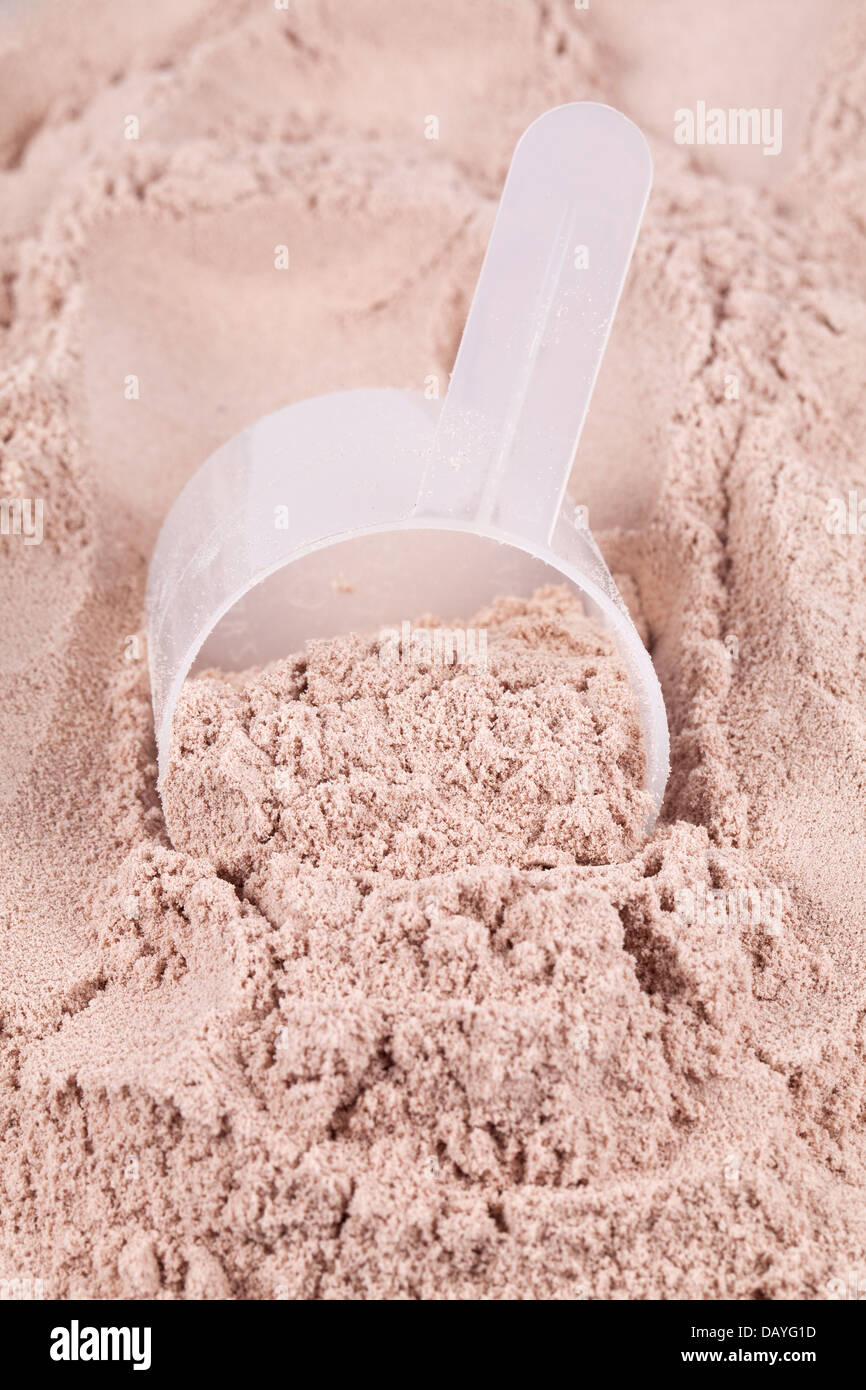 A scoop of chocolate whey isolate protein Stock Photo Alamy