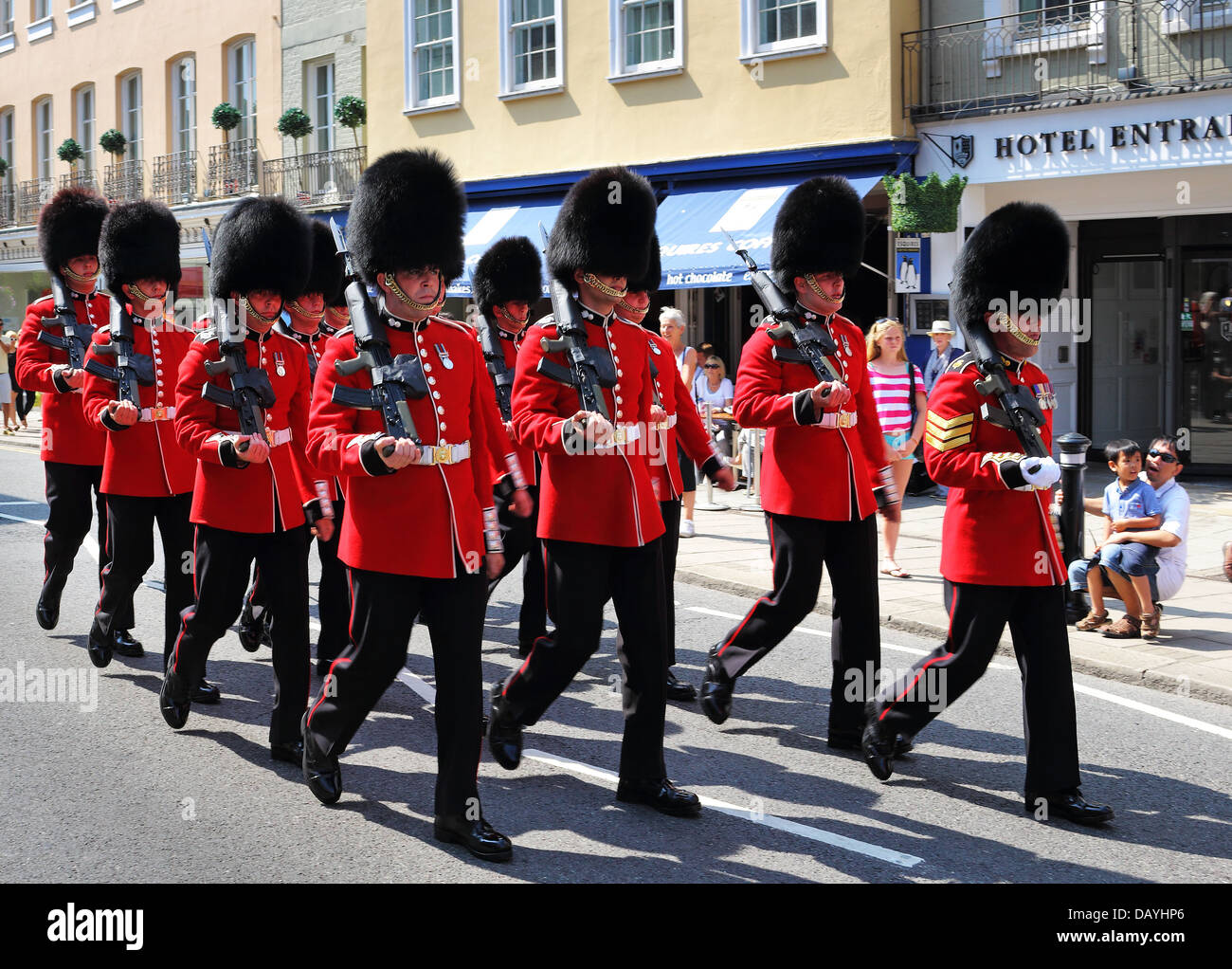 The Grenadier Guards marching through Royal Windsor for the Changing of the Guard Ceremony Stock Photo