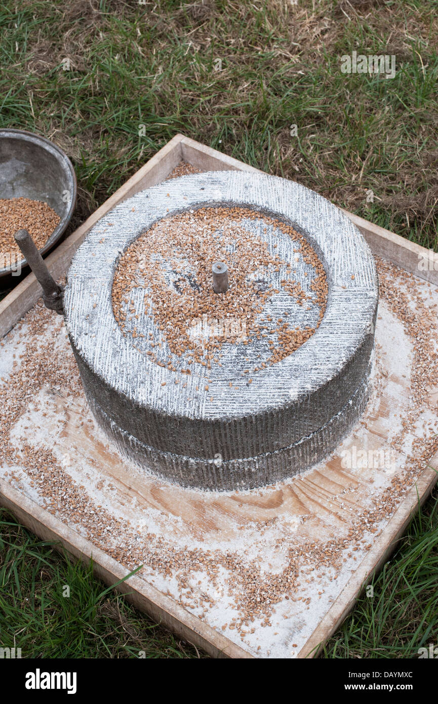 Roman Quern stones for grinding wheat and grains at a historical re enactment. UK Stock Photo