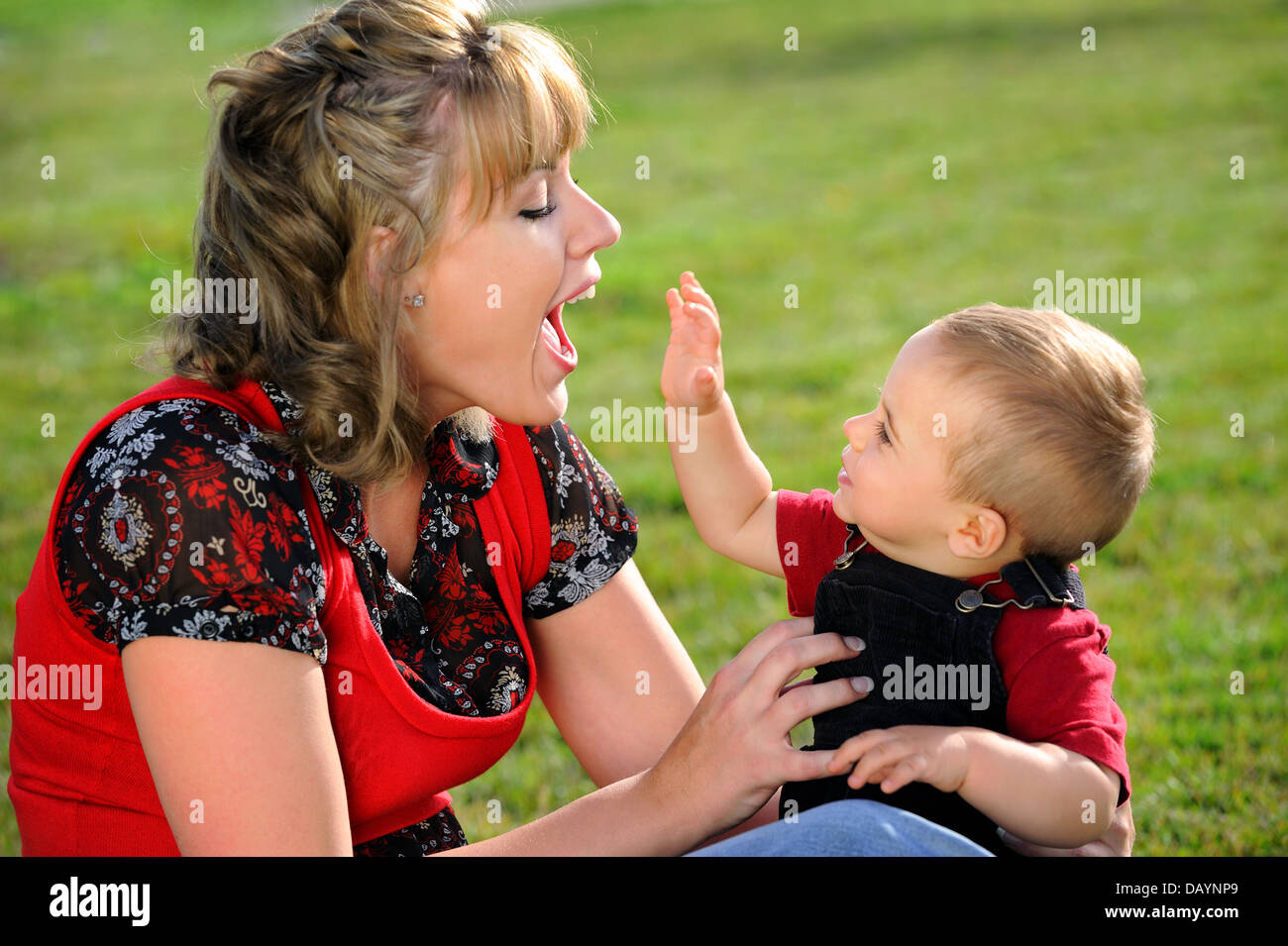 Happy mother playing with child Stock Photo