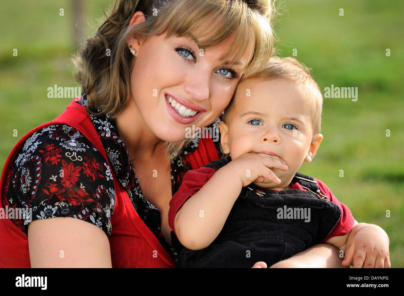 Happy young mother holding her child Stock Photo