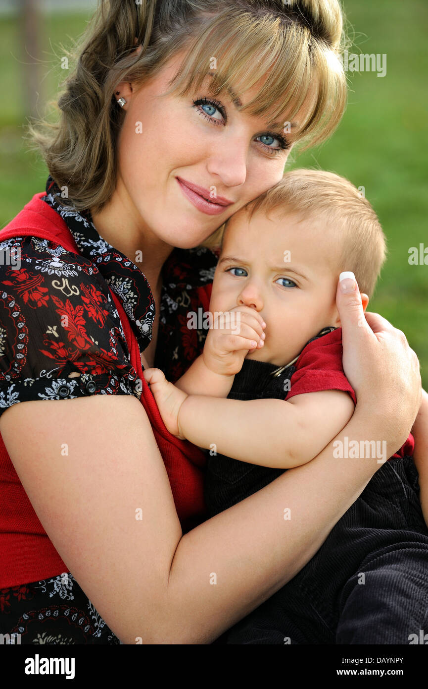 Happy young mother holding her child Stock Photo