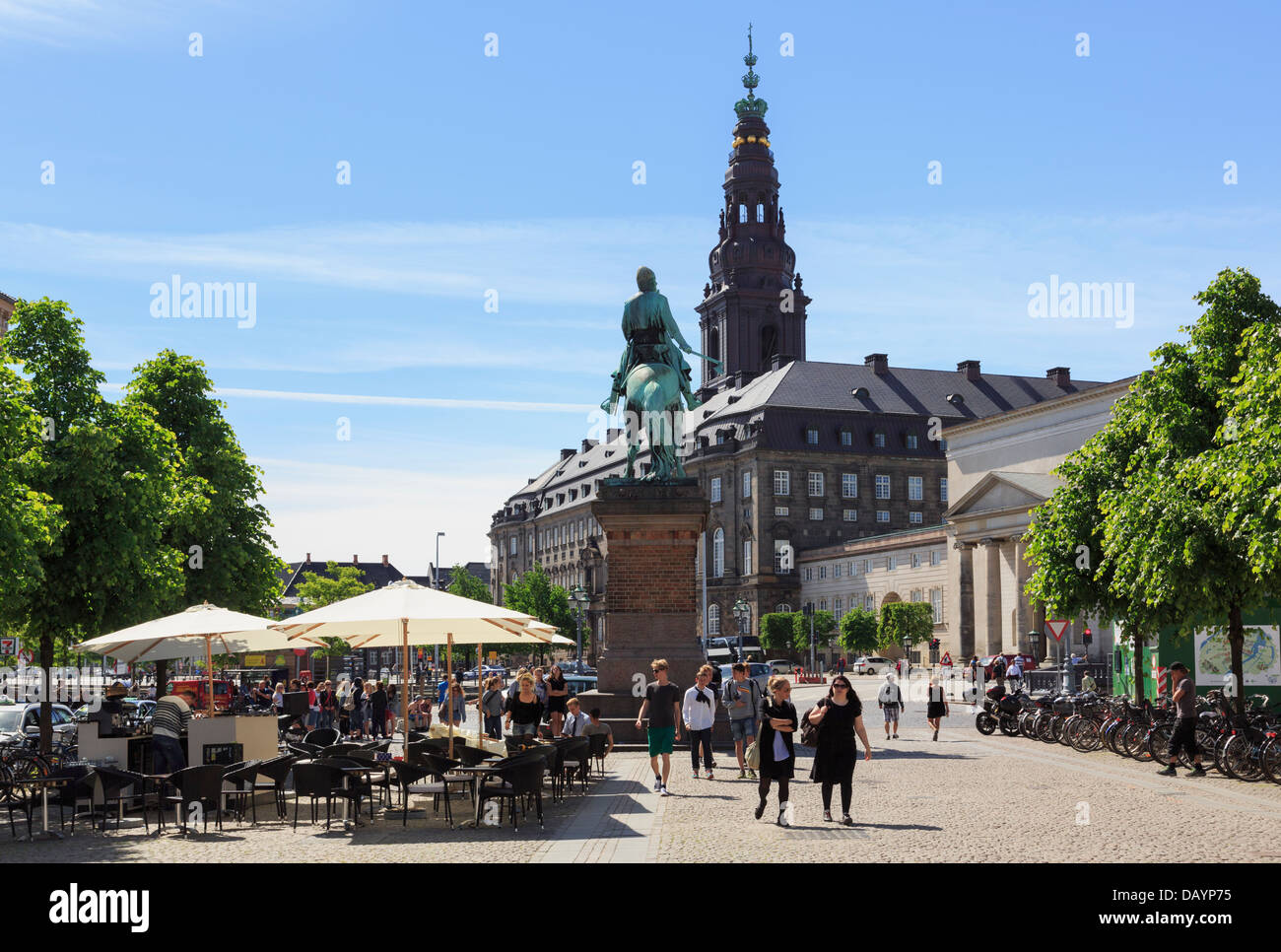 Street cafes and statue of Bishop Absalon in Hojbro Plads with Christiansborg Palace beyond. Copenhagen, Zealand, Denmark Stock Photo