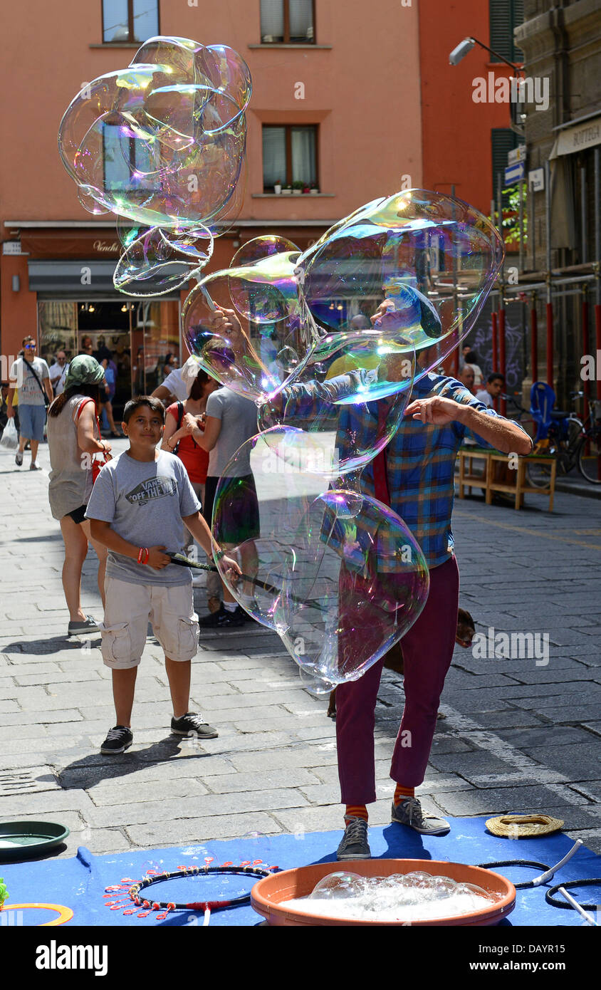 Man making bubbles in Bologna Italy Stock Photo