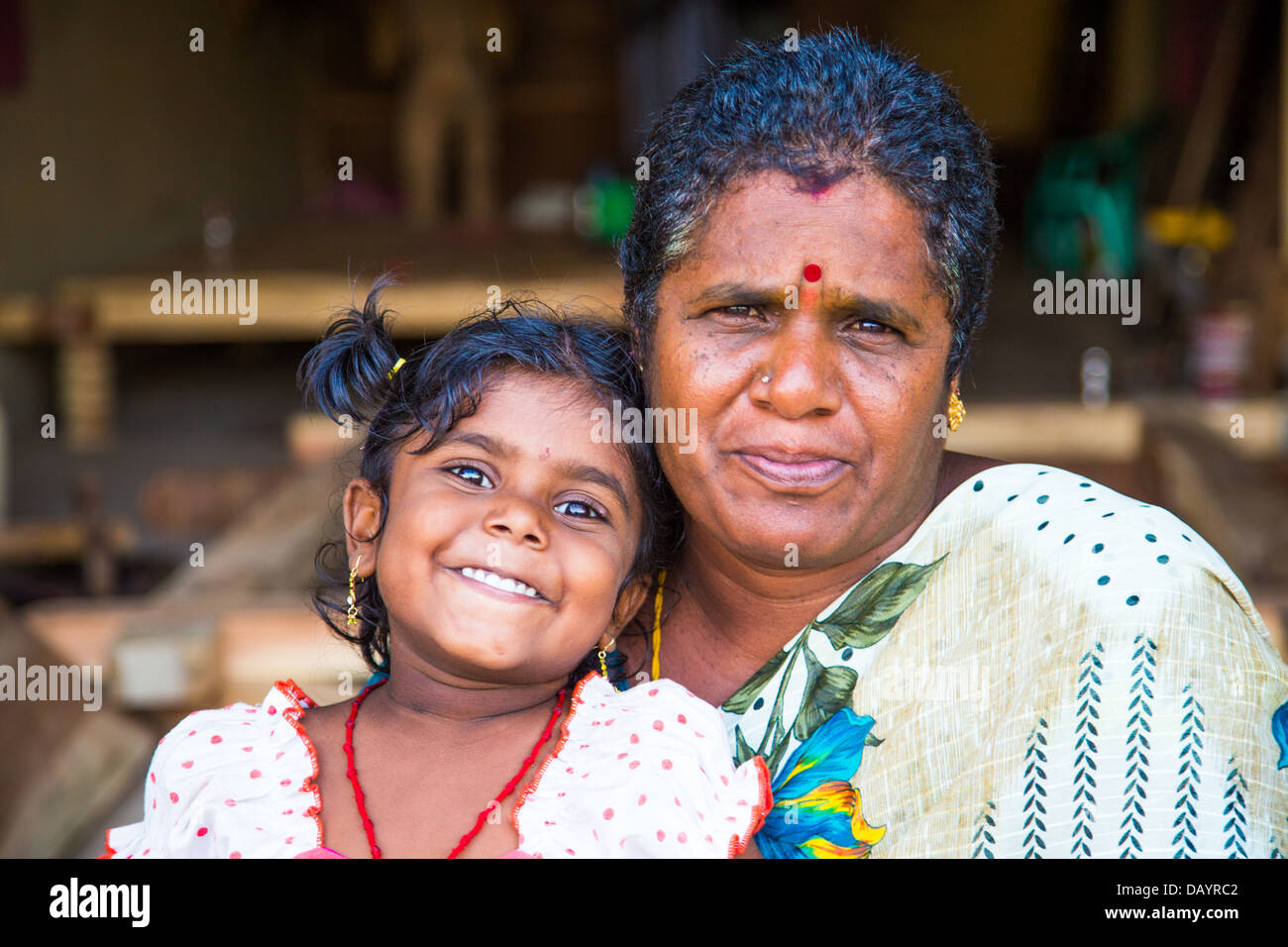 Young girl and her mother, Mahabalipuram or Mamallapuram, Tamil Nadu, India Stock Photo
