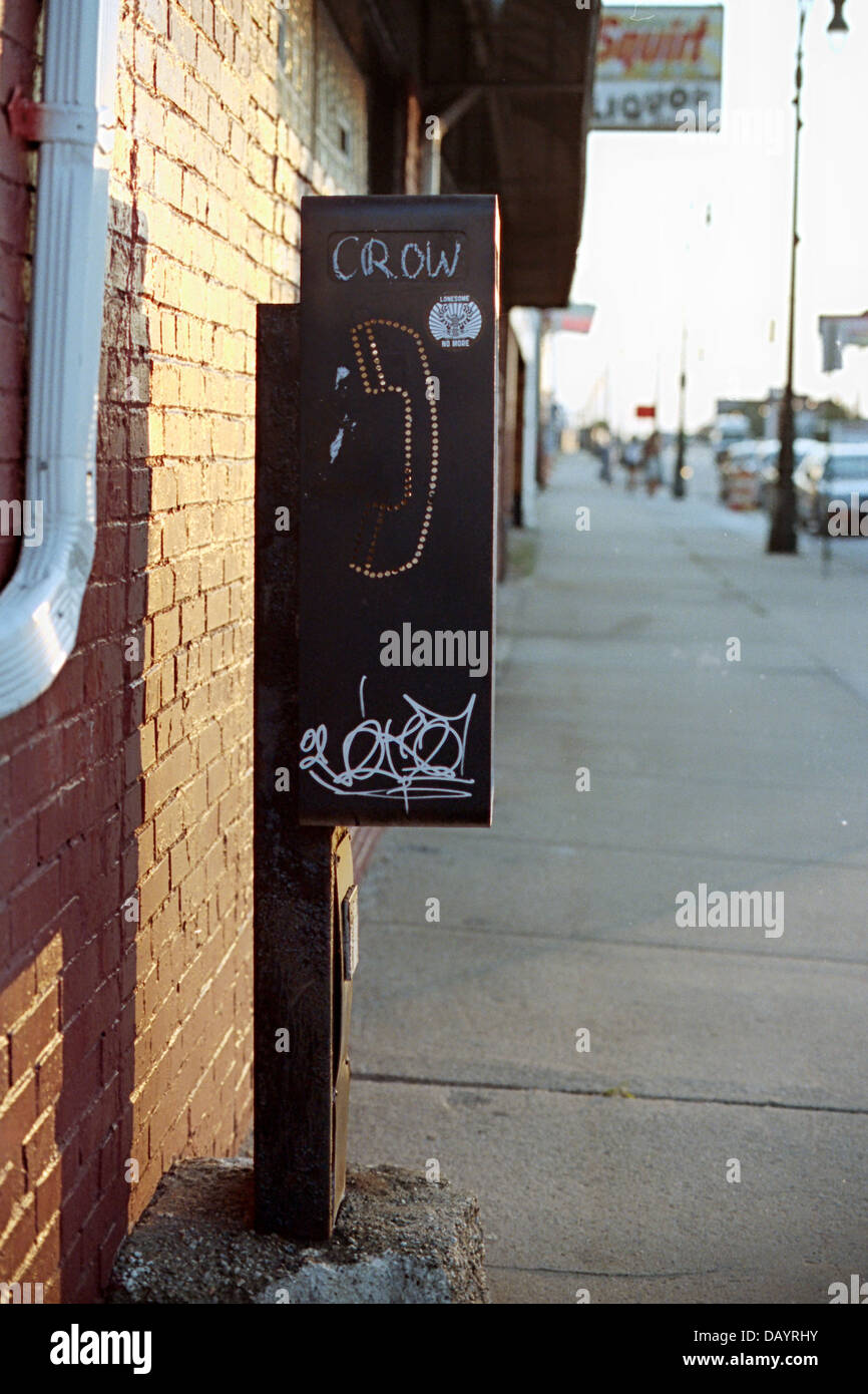View of a non-working phone booth found in the Corktown neighborhood of Detroit. Stock Photo