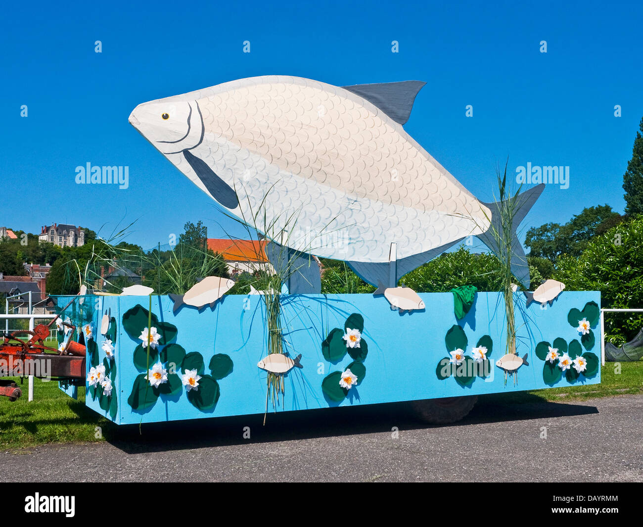 Decorative procession float displaying large fish France Stock Photo