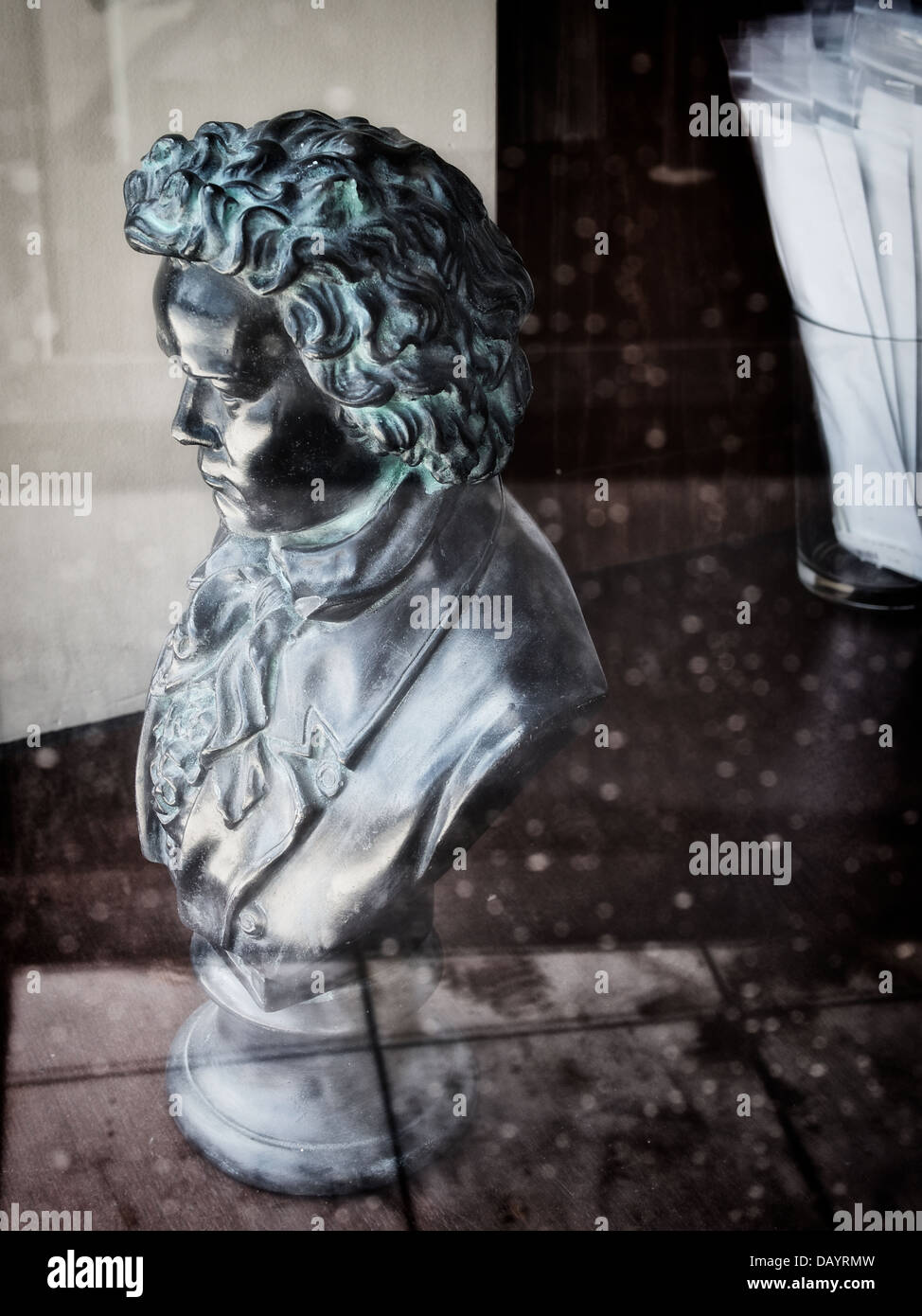 Bust of Beethoven mysteriously stares out a window. Stock Photo