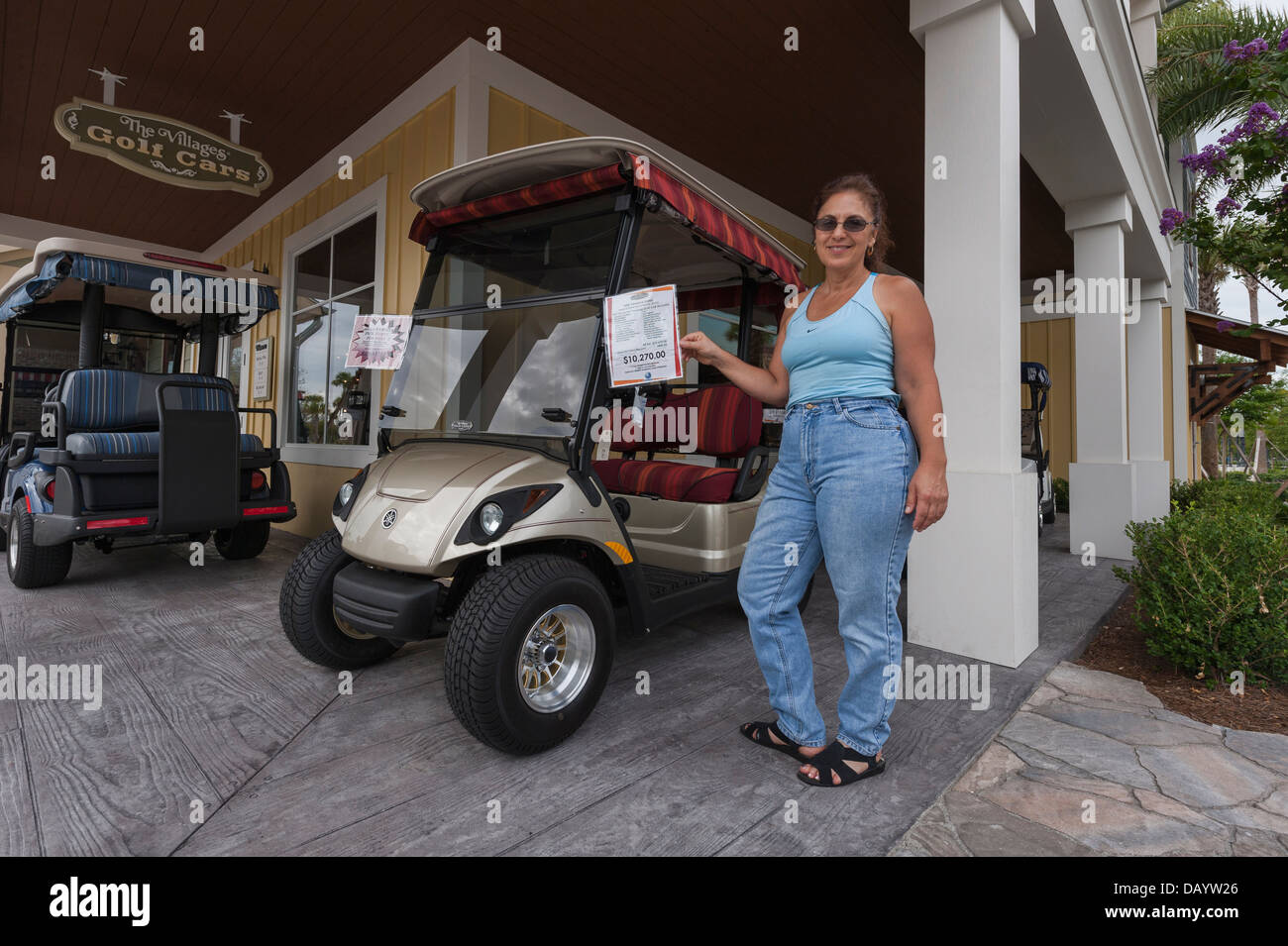 A woman interested in buying a golf car from Brownwood in the Villages