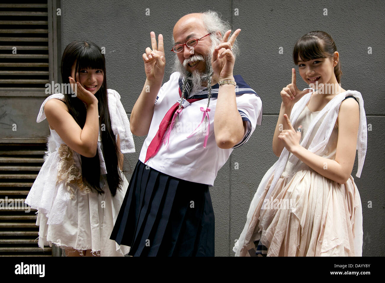 Tokyo, Japan. 20th July, 2013. The Japanese idol group 'Chaos de Japon' performance at Pasela Resorts Grande Shibuya on July 20, 2013. The middle-aged man 'Grow-Hair' (Hideaki Kobayashi), who is producer and member of the junior-high schoolgirls idol group 'Chaos de Japon', wears a schoolgirl uniform (Sailor Suit) every weekend around Tokyo. He holds a Master in Mathematics from Waseda University and works in a printing company on weekdays. He started wearing the schoolgirl uniform in June 2011, because of a Ramen shop promotion for which people in a Sailor-suit could get free noodles. Stock Photo