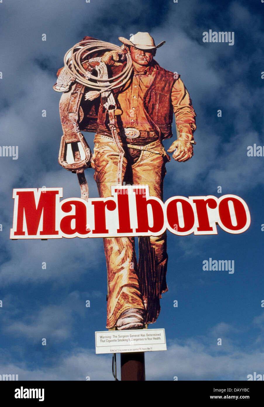 The Marlboro Man depicted by cowboys like this one on an outdoor sign in the USA was introduced in 1954 to promote smoking of filtered cigarettes. Stock Photo