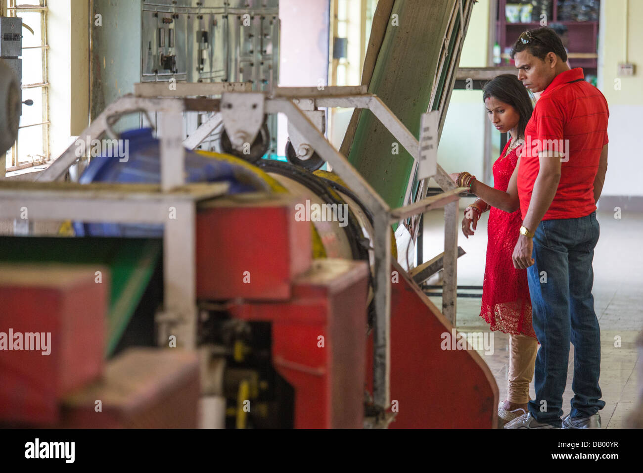 Domestic Indian tourists at a tea plantation factory tour, Munar, India Stock Photo