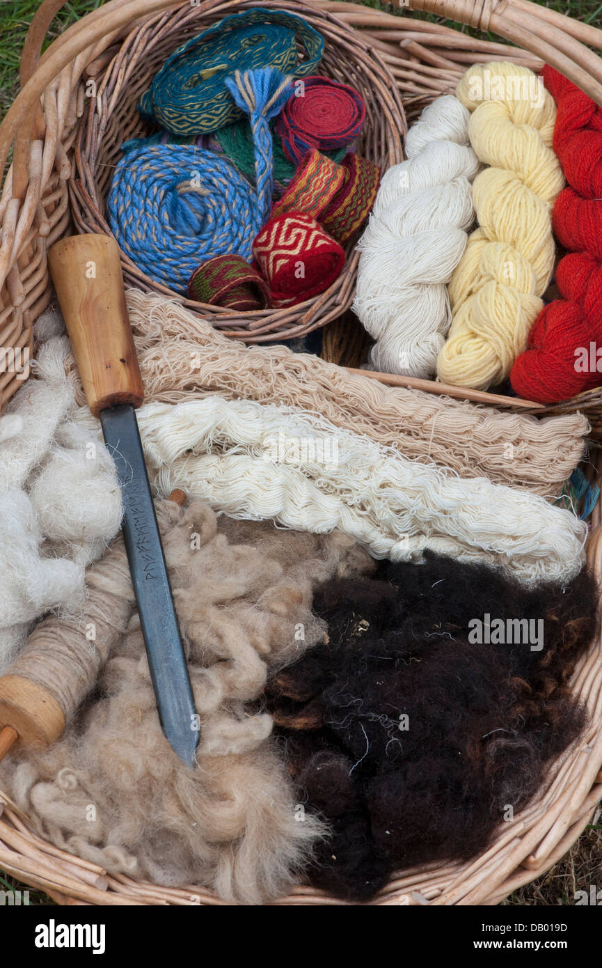 Anglo Saxon weavers basket with wool, yarn and decorative braids at a historical re enactment Stock Photo