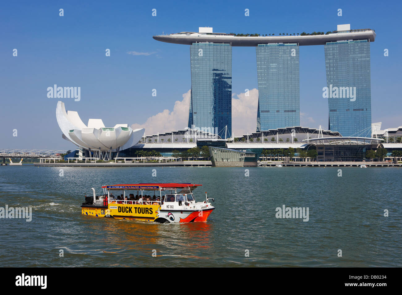 Duck Tours DUKW amphibious vehicle passing by the Marina Bay Sands Hotel, Singapore. Stock Photo