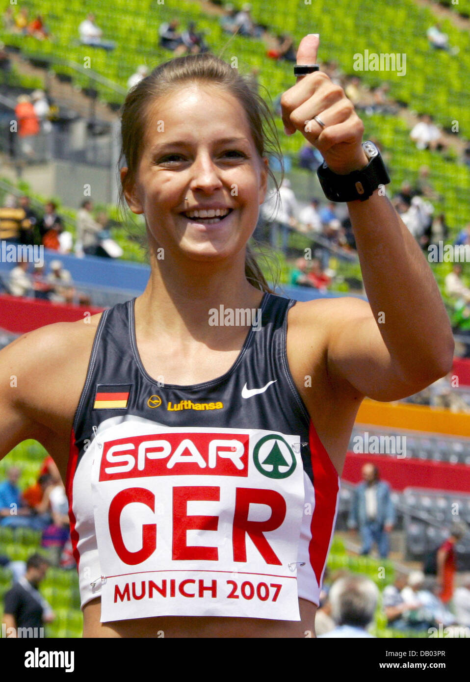 German sprinter Sina Schielke cheers after finishing the second run of the 100m sprint competition in 11,21 seconds at the SPAR European Cup in Munich, Germany, 23 June 2007. Schielke is the first German this year to underbid the norm for the world championships in Japan in August. Photo: Matthias Schrader Stock Photo