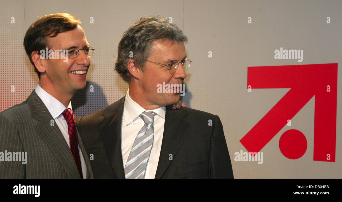 CEOs of ProSiebenSat.1, Guillaume de Posch (L) and SBS Broadcasting, Patrick Tillieux, stand next to the ProSiebenSat.1 company logo in Munich, Germany, 27 June 2007. ProSiebenSat.1 will take over SBS Broadcasting, a group of European TV stations, to become Europe's second biggest broadcasting company following RTL group. The merger will be completed at the beginning of July 2007.  Stock Photo