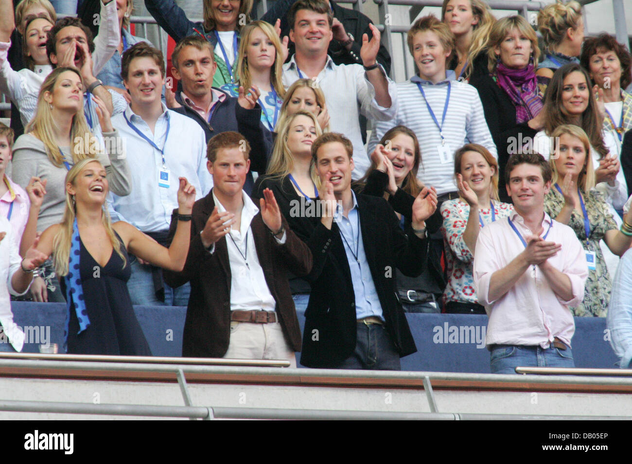 Prince William (2nd R), Prince Harry (2nd L) and his girlfriend Chelsy Davy (L) seen in the crowd at the charity concert in memory of Diana, Princess of Wales on what would have been her 46th birthday at Wembley Stadium, London, 1 July 2007. Photo: Hubert Boesl Stock Photo