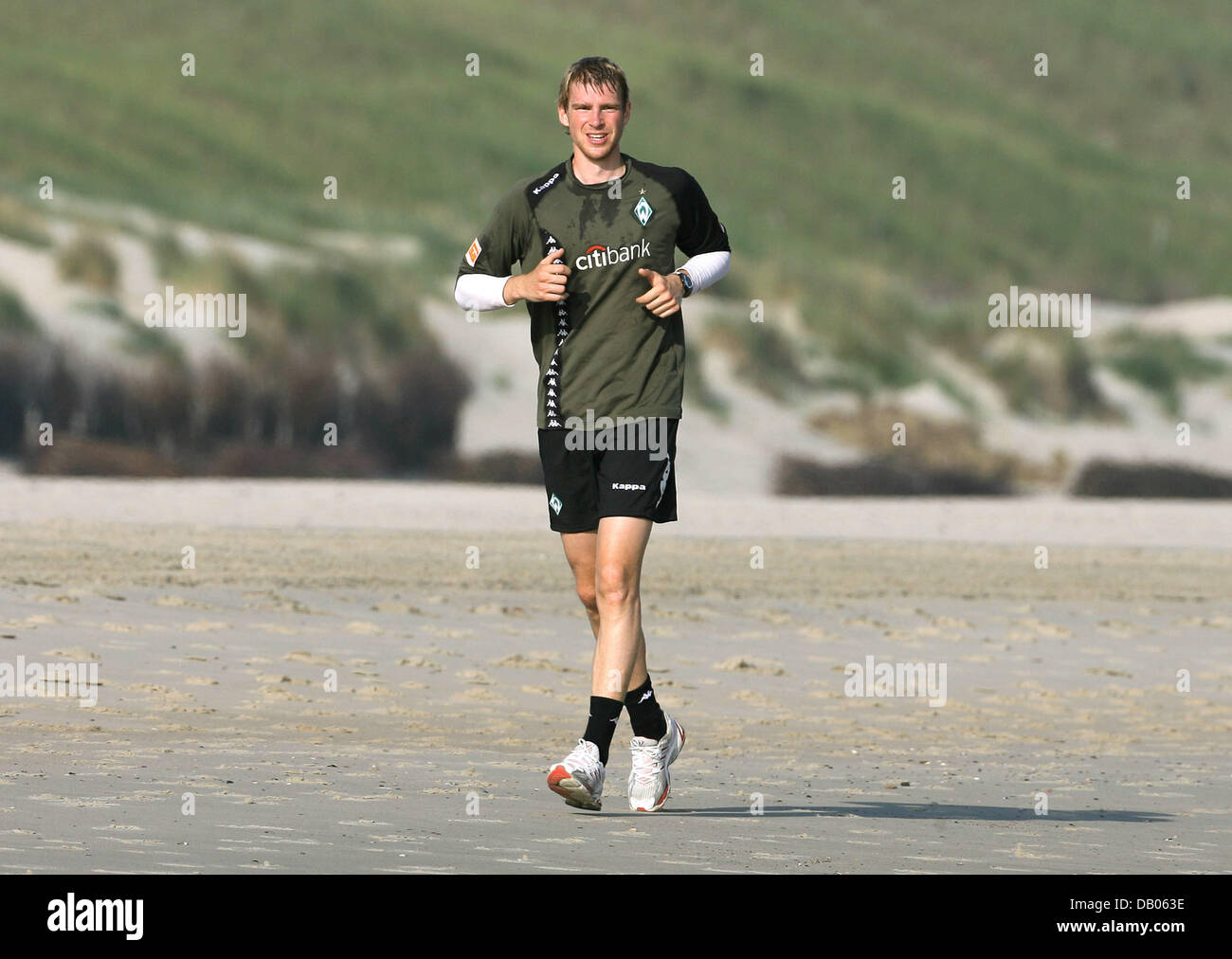 Bundesliga club SV Werder Bremen full back Per Mertesacker pictured jogging  at the beach on Norderney,
