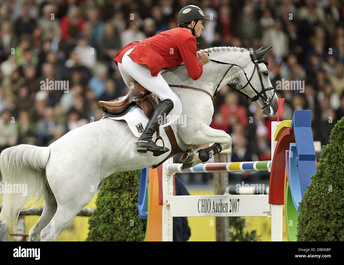 German equestrian Christian Ahlmann and his horse 'Coester' take an