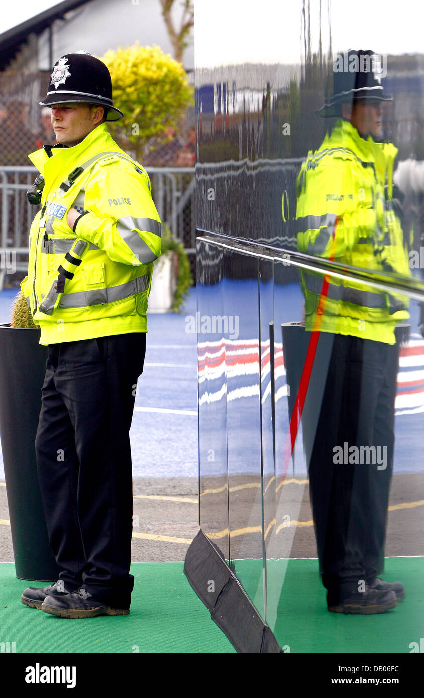 A police officer stands guard at Silverstone Circuit in Silverstone, United Kingdom, 06 July 2007. The 2007 Formula 1 British Grand Prix will be held on 08 July. PHOTO: JENS BUETTNER Stock Photo