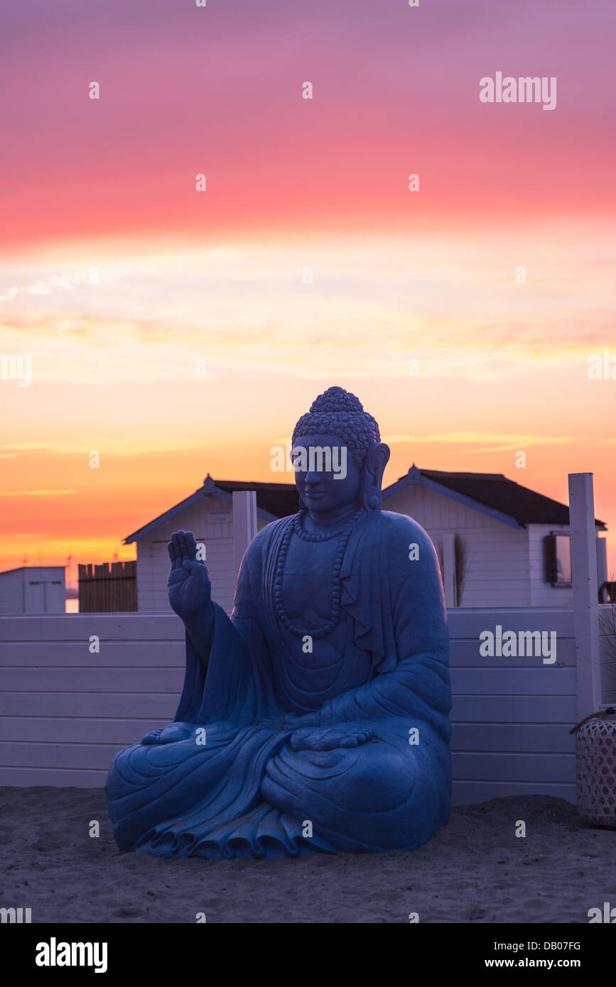 Blue buddha statue and sunset Stock Photo Alamy