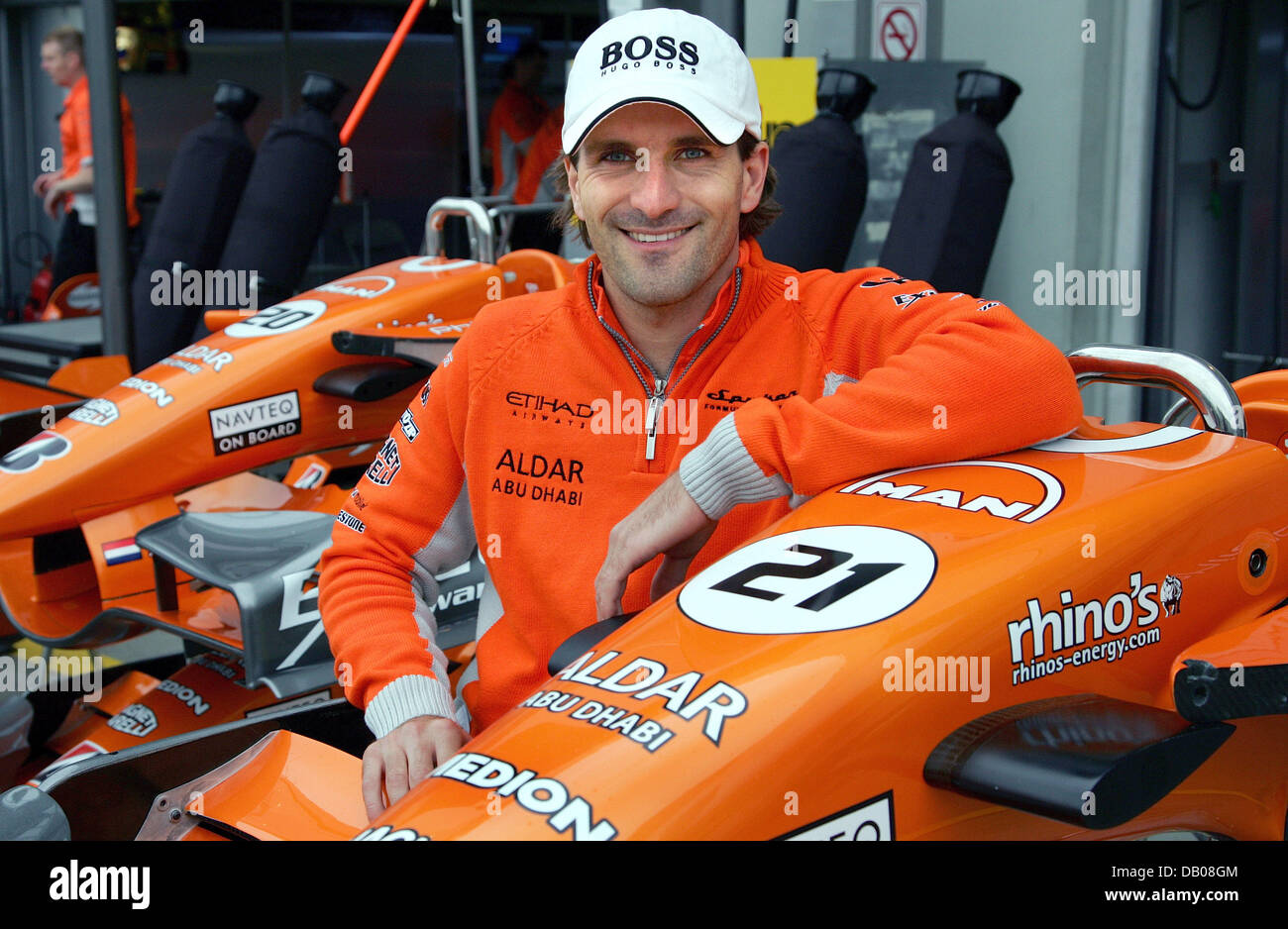 german-formula-one-pilot-markus-winkelhock-of-spyker-poses-with-his-car