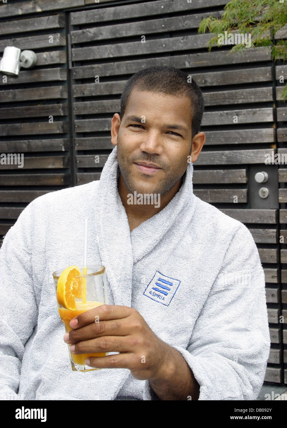German international Stephen Arigbabu enjoys a glass of juice during