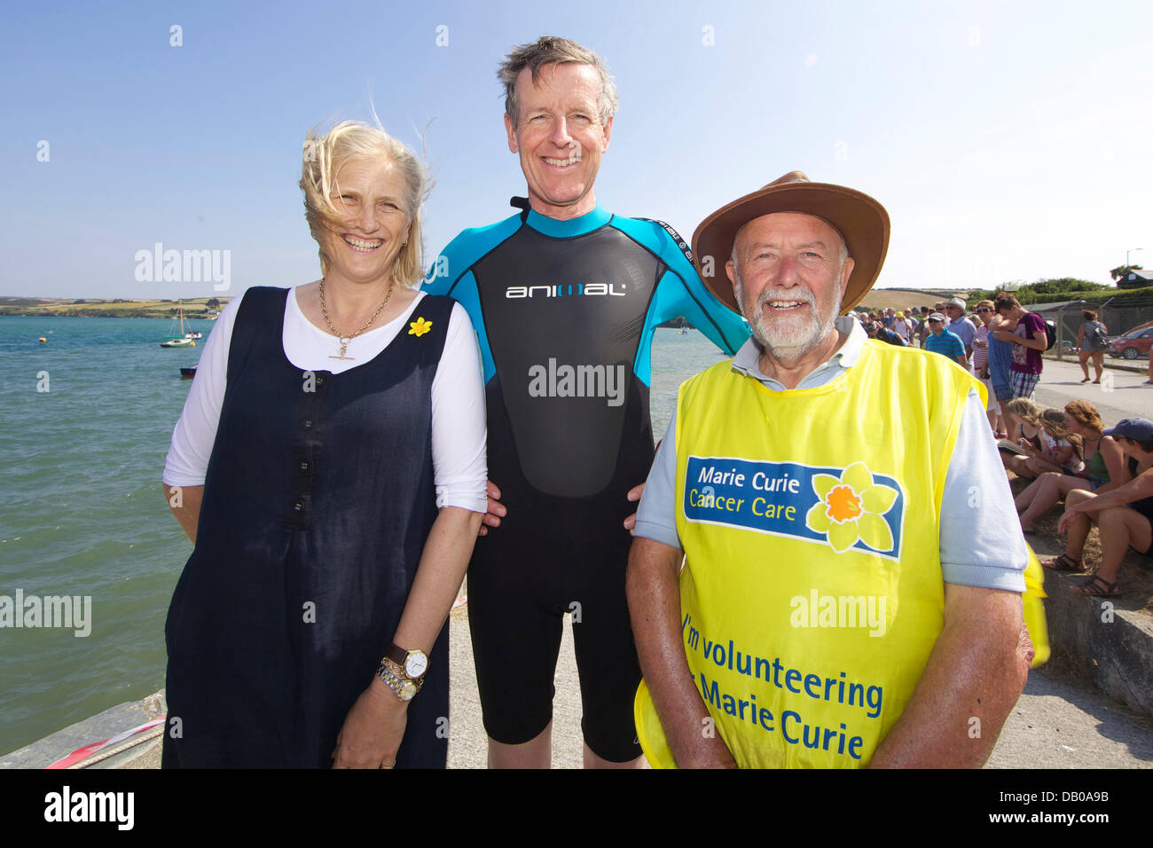 Padstow, UK. 21st July, 2013. Cornwall County Marie Curie Cancer Care Patron Alexandra Bolitho, her husband Lord Lieutenant Edward Bolitho and Marie Curie volunteer Nick Hinchlinn await the starters instructions. Credit:  Jeremy Northcott/Alamy Live News Stock Photo