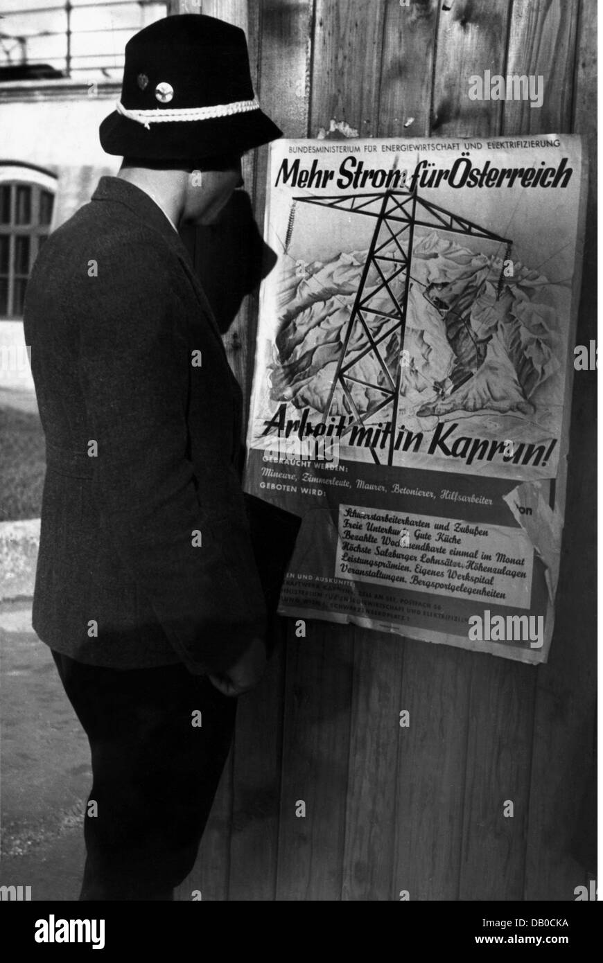 energy, water, man in front of advertising poster for the recruitment of workers for the construction of the Kaprun power station, Austria, circa 1950, Additional-Rights-Clearences-Not Available Stock Photo