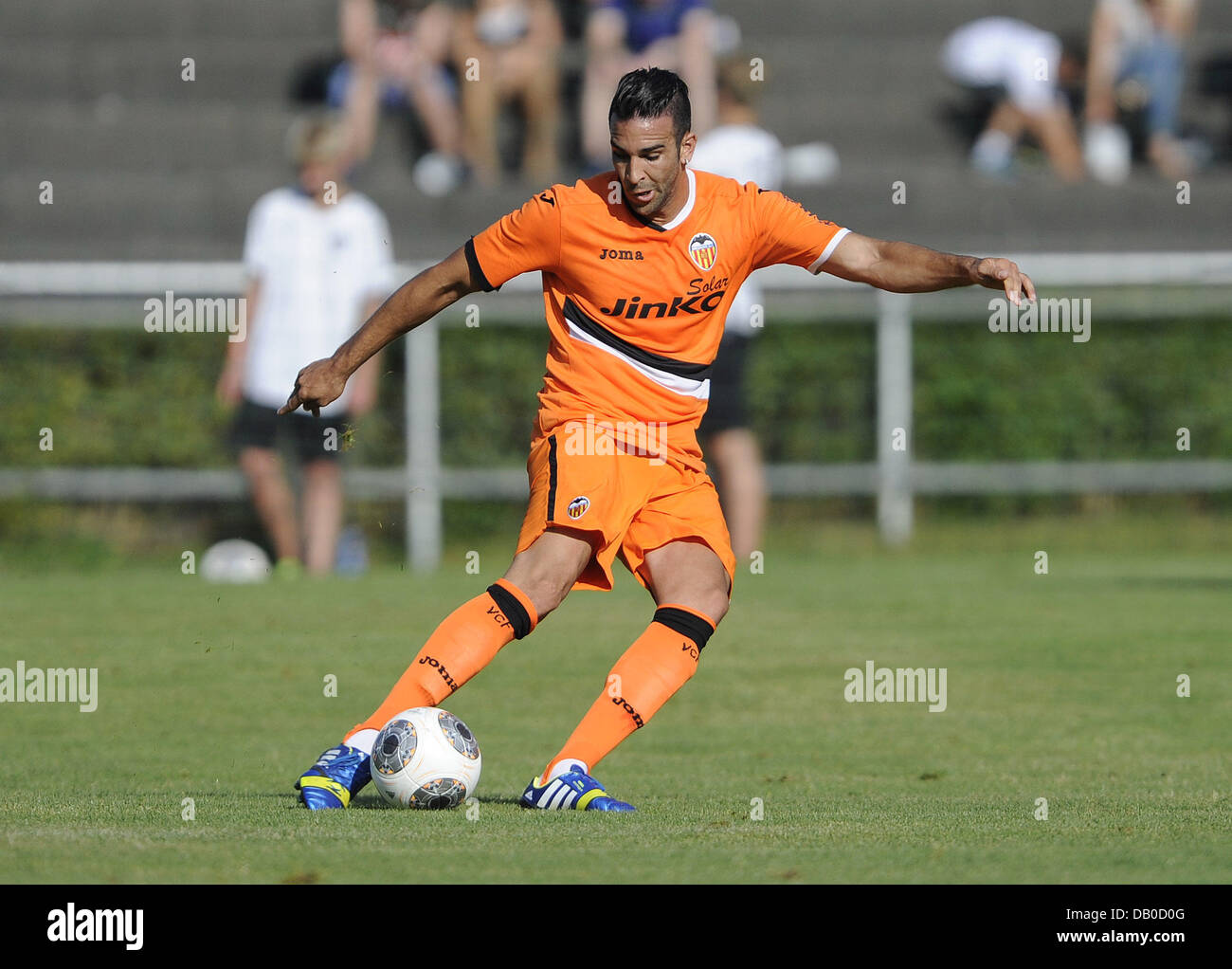 Ludwigsburg, Germany. 20th July, 2013. Adil Rami of Valencia plays the ball during the test match VfB Stuttgart vs FC Valencia in the Ludwig-Jahn-Stadion in Ludwigsburg, Germany, 20 July 2013. Photo: DANIEL MAURER/dpa/Alamy Live News Stock Photo