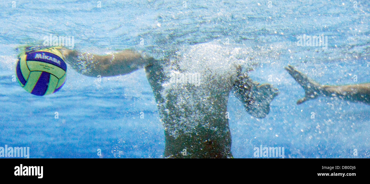 Two players are pictured underwater during the match Australia vs