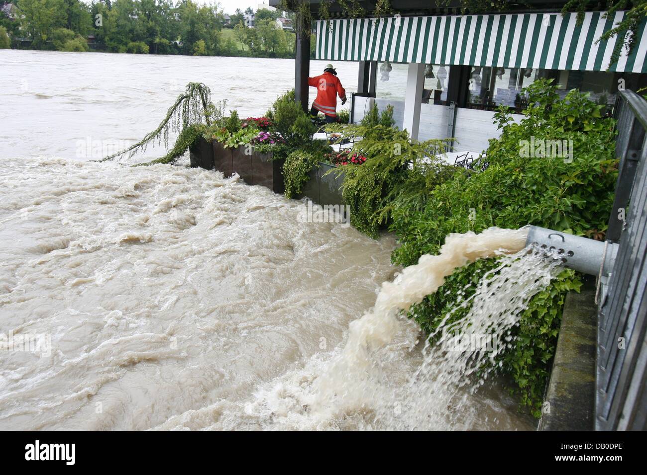 Firemen Of German Rheinfelden Pump Water Off A Hotel S Terrace In Stock Photo Alamy