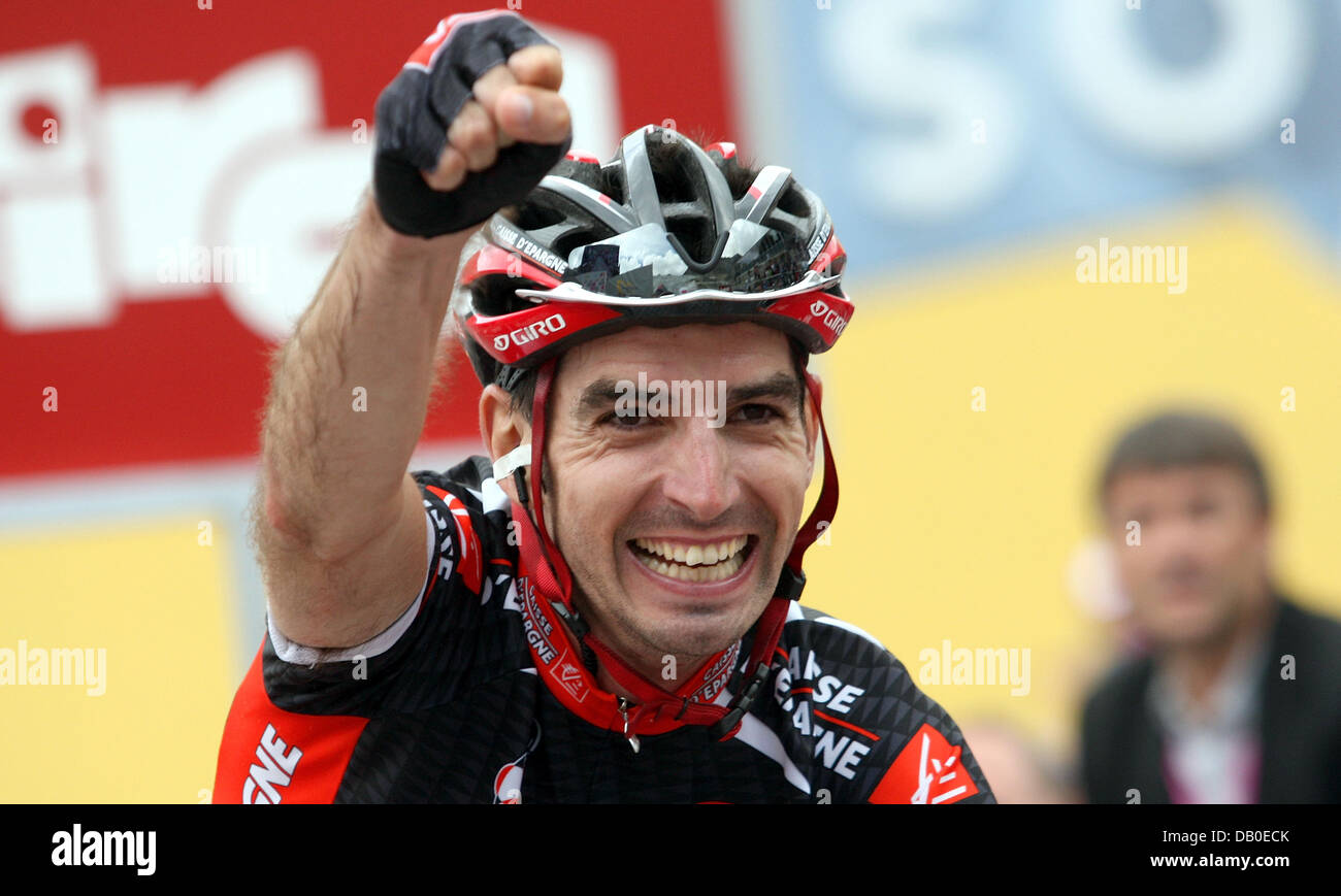 Spanish cyclists David Lopez Garcia of the Team Caisse d'Epargne cheer...