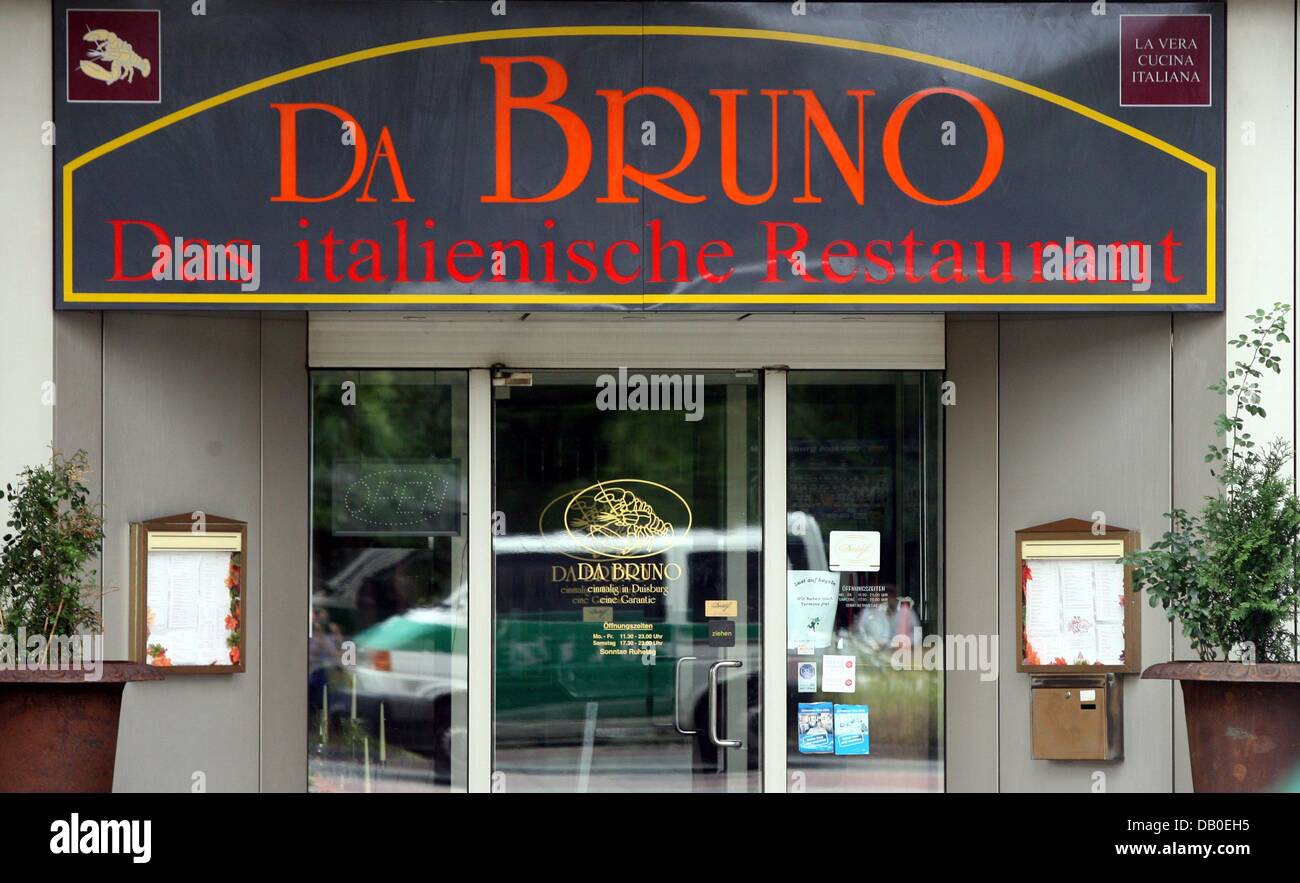 A Police Car Is Reflected In The Glass Door Of Italian A Police Car Is Reflected In The Glass Door Of Italian Restaurant Da Bruno Near Central Station Duisburg Germany 15 August 2007
