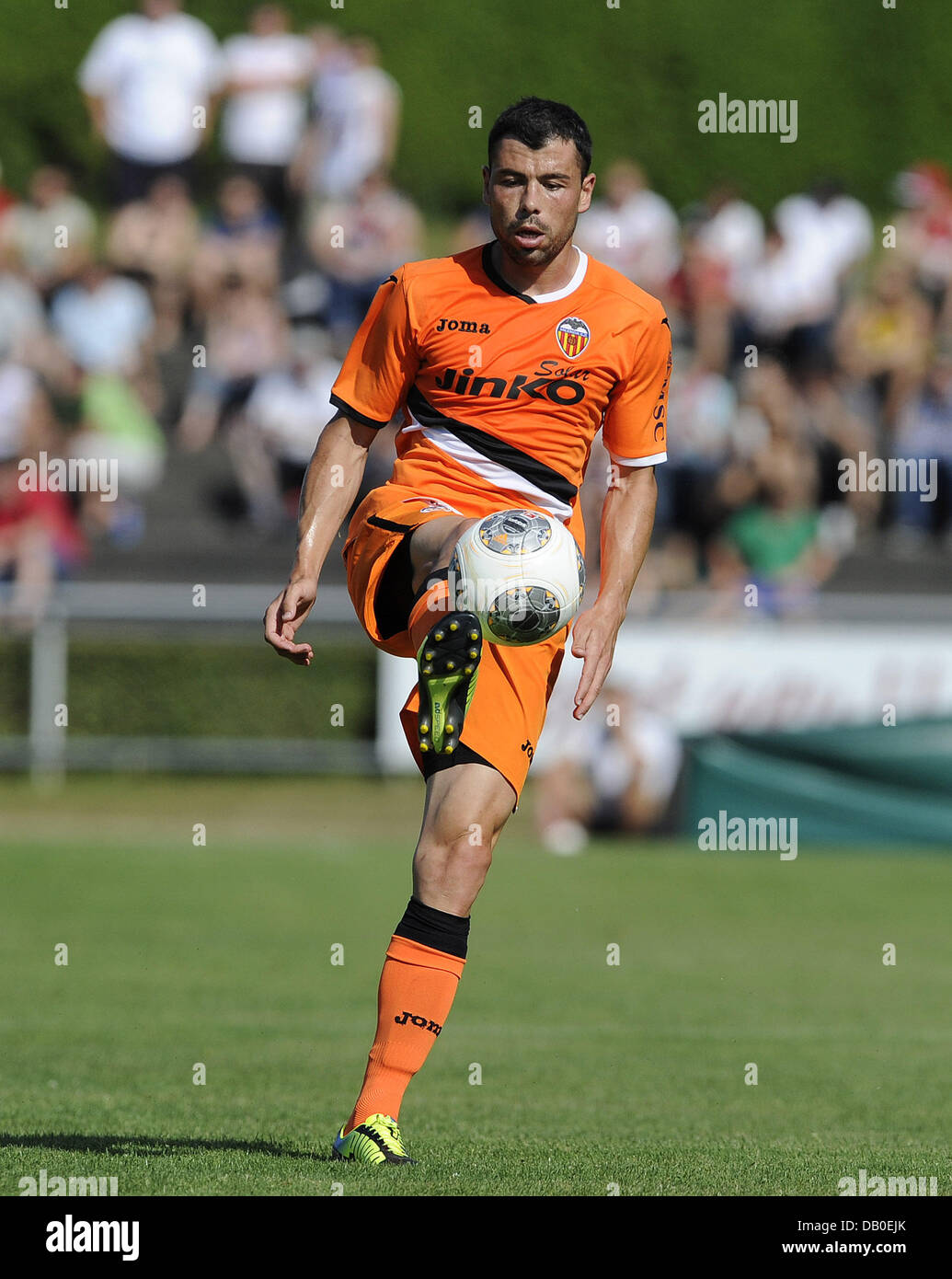 Ludwigsburg, Germany. 20th July, 2013. Javi Fuego of Valencia plays the ball during the test match VfB Stuttgart vs FC Valencia in the Ludwig-Jahn-Stadion in Ludwigsburg, Germany, 20 July 2013. Photo: DANIEL MAURER/dpa/Alamy Live News Stock Photo