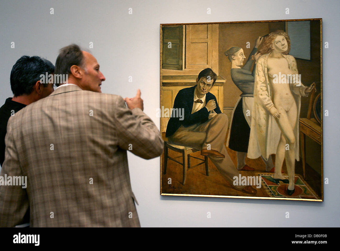 Visitors observe the 1933-painting 'Cathy's Toilette' by Balthus (Balthasar  Klossowski, 1908-2001) at 'Museum Ludwig' in Cologne, Germany, 17 August  2007. The French artist's first solo exhibition in Germany presents about  70 significant