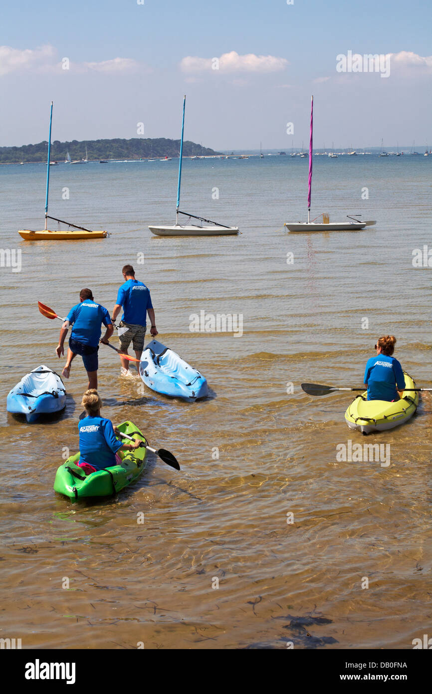 group wearing The Watersports Academy tshirts getting into colourful