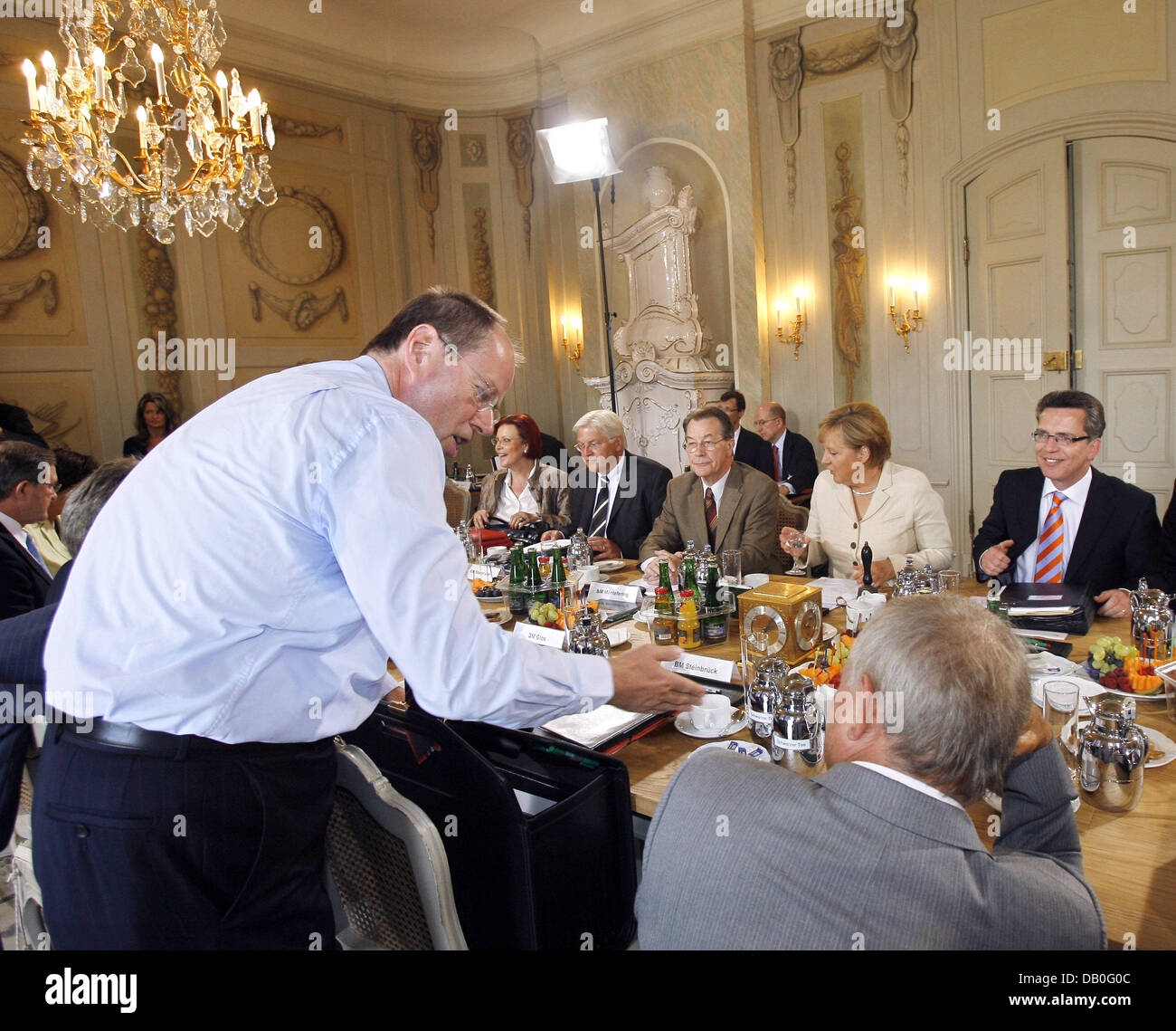 German Minister of Finances, Peer Steinbrueck (L) talks with the Minister of the Interior, Wolfgang Schaeuble (R), during a German cabinet meeting in Meseberg, Germany, 23 August 2007. The cabinet members are scheduled to discuss on energy and immigration politics. Photo: Bernd Settnik Stock Photo