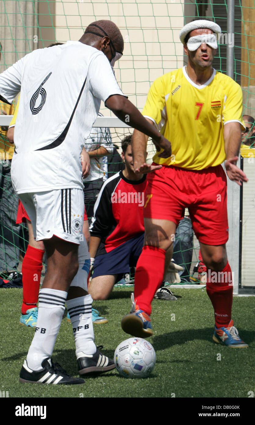 Blind soccer players shown in action during the match Germany (white