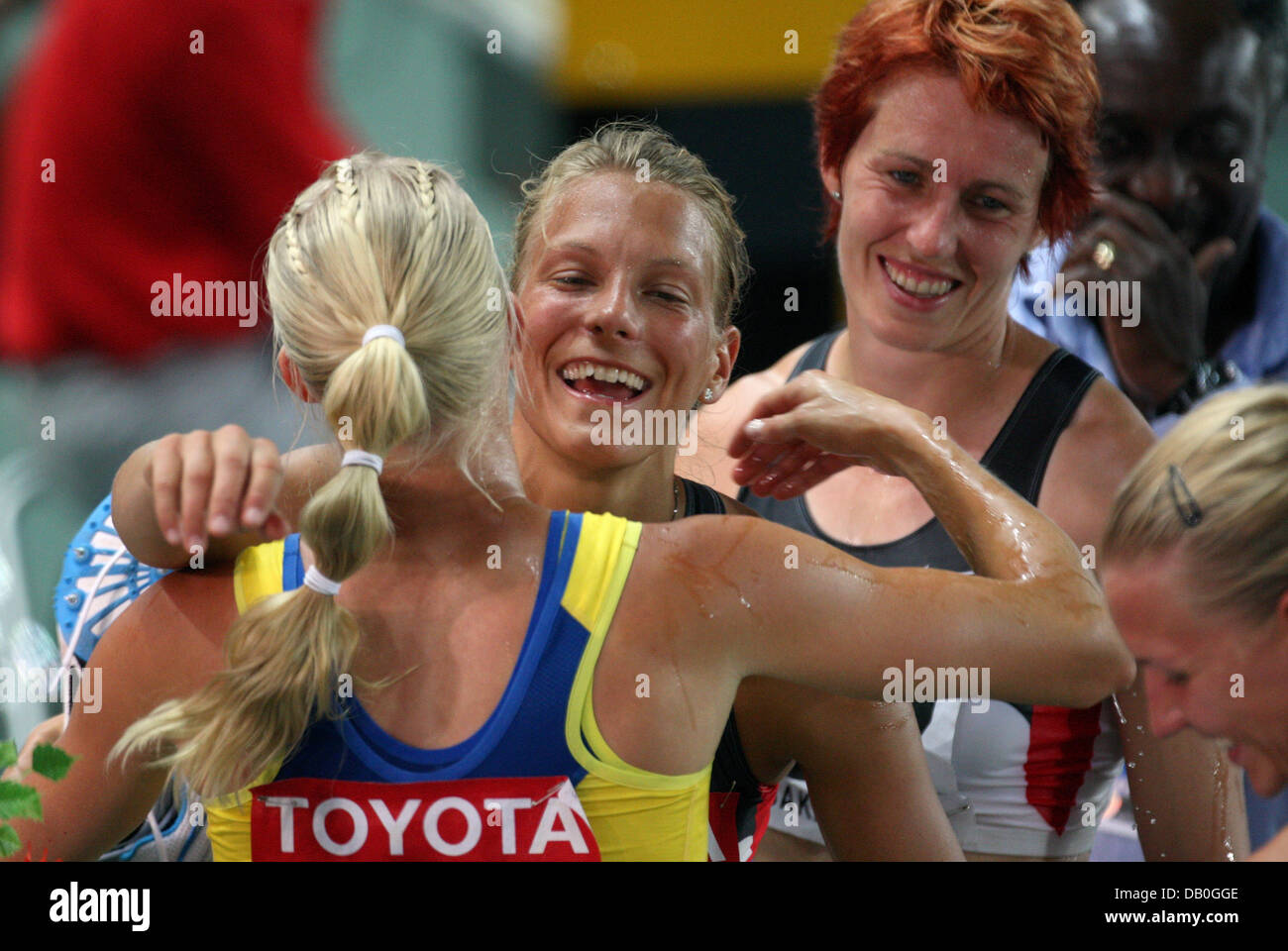 Swedish heptathlete Carolina Klueft (L) is congratulated to her victory by Germany's Lilli Schwarzkopf (R-L), Sonja Kesselschlaeger and Jennifer Oeser after the heptathlton competition at the IAAF Athletics World Championships at Nagai stadium in Osaka, Japan, 26 August 2007. Photo: Gero Breloer Stock Photo