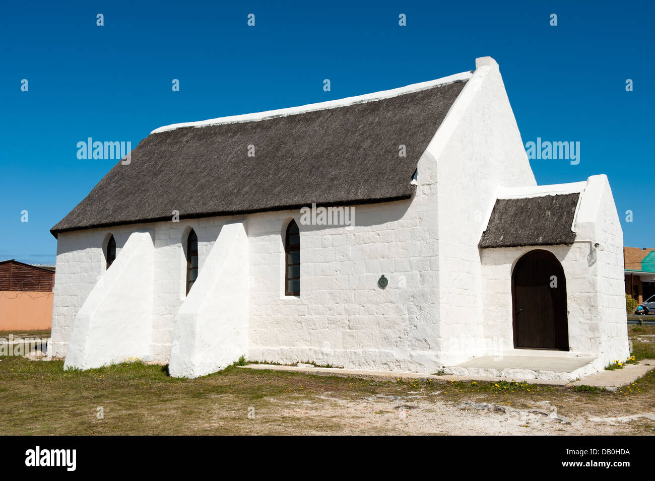 The thatched roof Anglican church is a National Monument, Struisbaai, South Africa Stock Photo